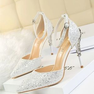 White glitter stiletto heels with silver metal vines detail on heels